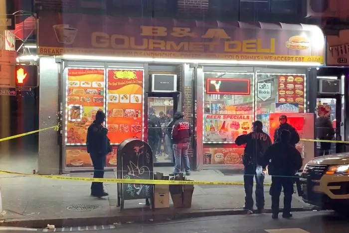 Police investigate the fatal shooting of deli worker Yahya Almunster, killed February 14 inside the B & A Gourmet Deli